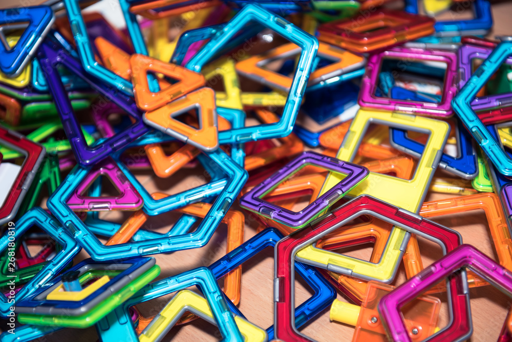 Children's constructor for the development of fine motor skills and creative thinking. Bright and colorful, allows you to create complex shapes. Close-up. Children's constructor for the development of fine motor skills and creative thinking. Bright and colorful, allows you to create complex shapes. Close-up.