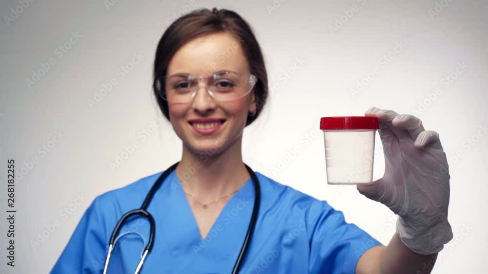 Medical laboratory scientist holds in his hand medical container for analyzes. Health care, medical tests. Medical laboratory scientist holds in his hand medical container for analyzes. Health care, medical tests.