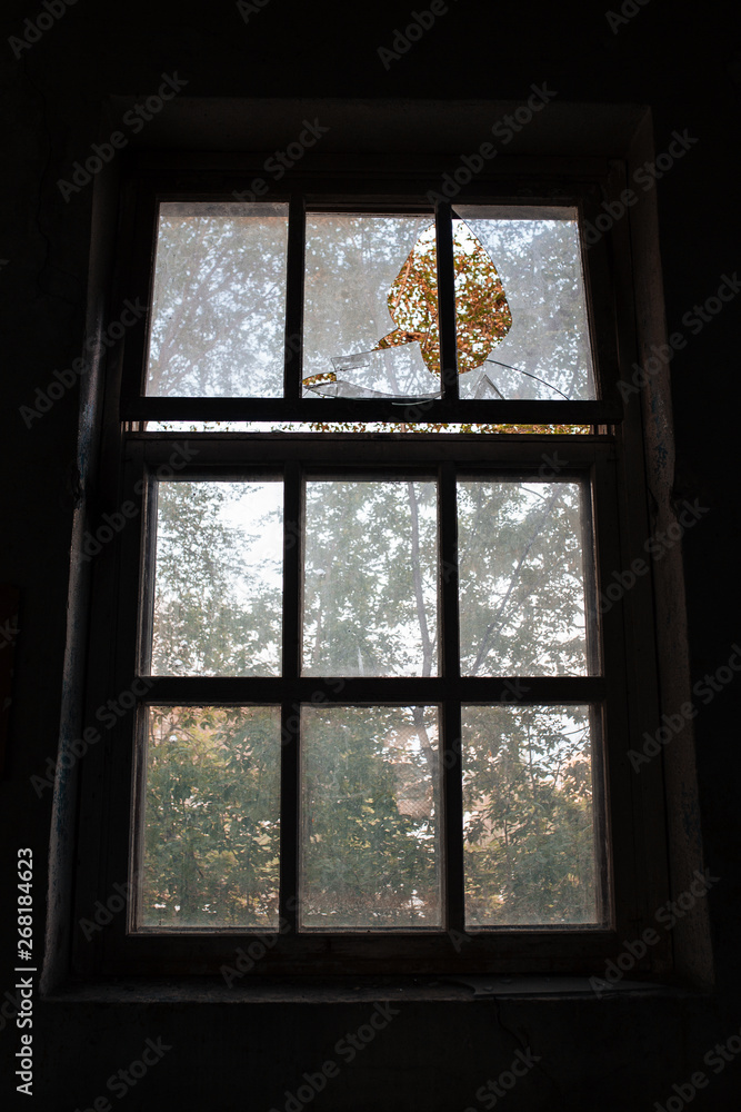 Broken window in a ruined building, war Broken window in a ruined building, war