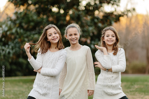 Three sister doing silly poses together