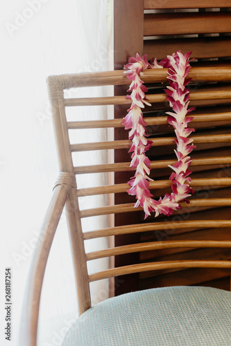 Lei Sitting on Wooden Chair photo