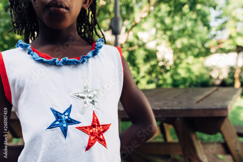 Black girl wearing USA themed shirt for the 4th of July parade photo