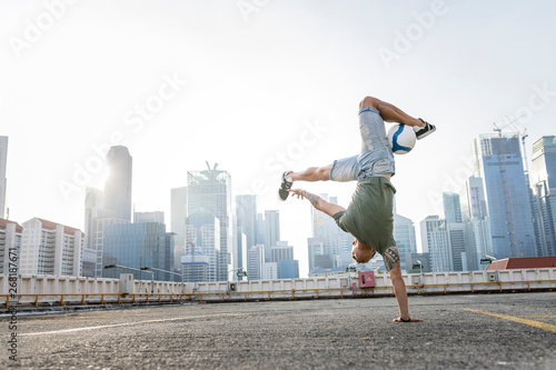 Two freestyle footballer on a rooftop