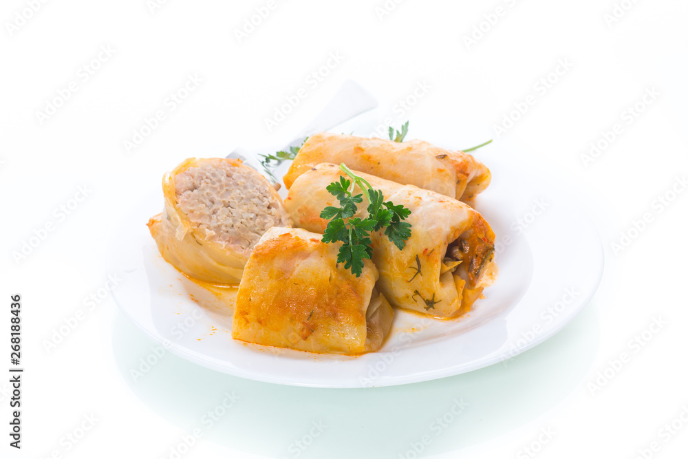 Stuffed cabbage leaves with minced meat and rice in tomato sauce.