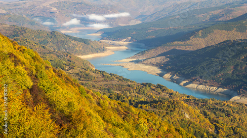 Autumn scene from viewpoint Goat rock with close up view of meandering lake Zavoj during misty morning © Nikola