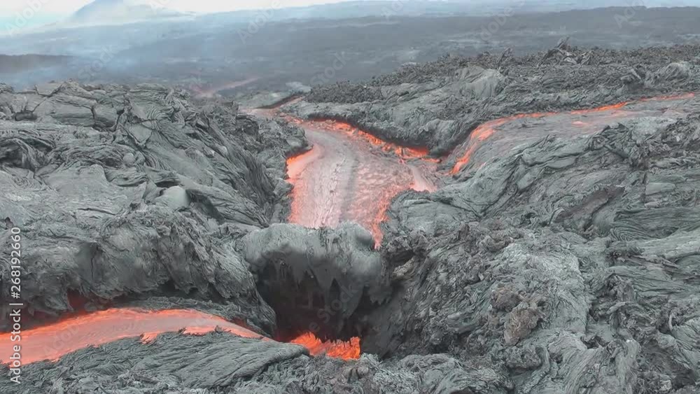 Streams of hot lava from a volcanic eruption (close-up) Streams of hot lava from a volcanic eruption (close-up)