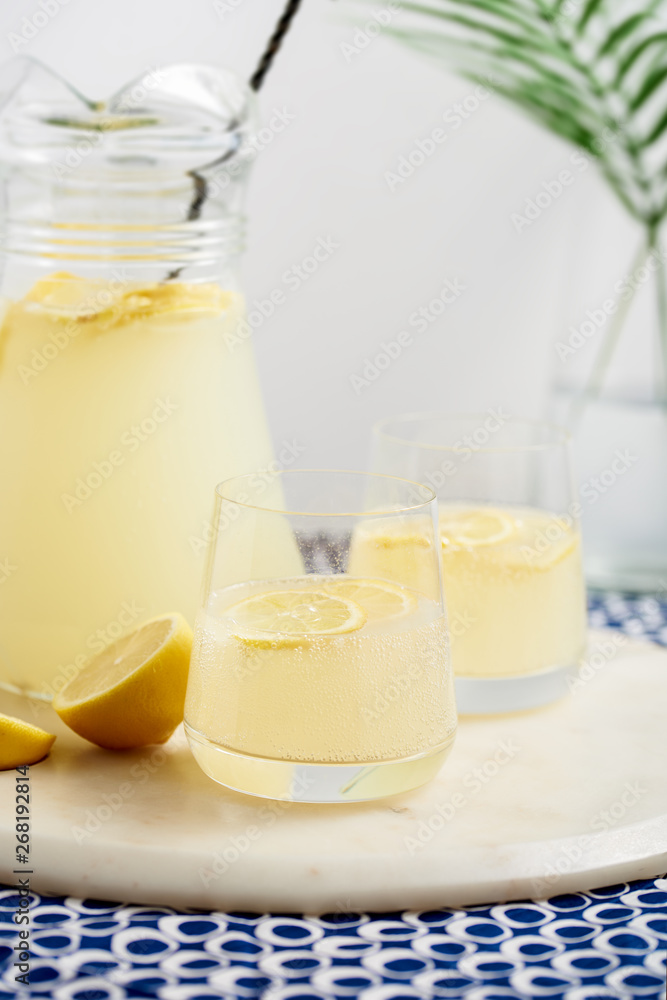 Two glasses and a jug of lemonade. Two glasses and a jug of lemonade.