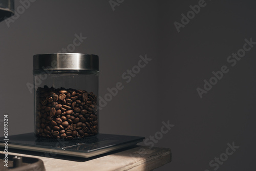 Freshly rosated coffee in a glass jar photo