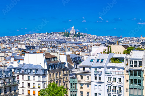 Paris, typical roofs in the Marais, aerial view with the Sacre-Coeur basilica 