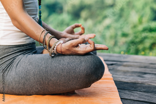 Closeup of Woman's Hands in Yoga Meditation Mudra photo