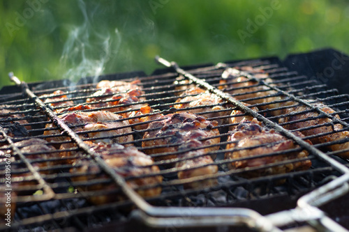 Fragrant chicken legs in the grill.