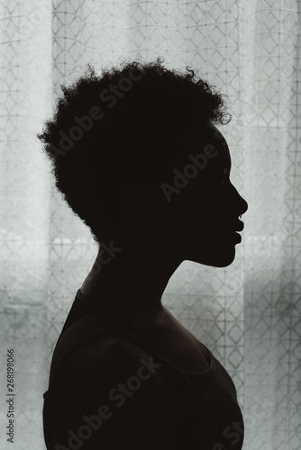 A young African American woman in silhouette photo