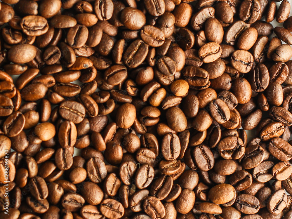 coffee beans (good and bad grain) - arabica and robusta blend (roasted coffee grain). Black background. Top view . Copy space coffee beans (good and bad grain) - arabica and robusta blend (roasted coffee grain). Black background. Top view . Copy space