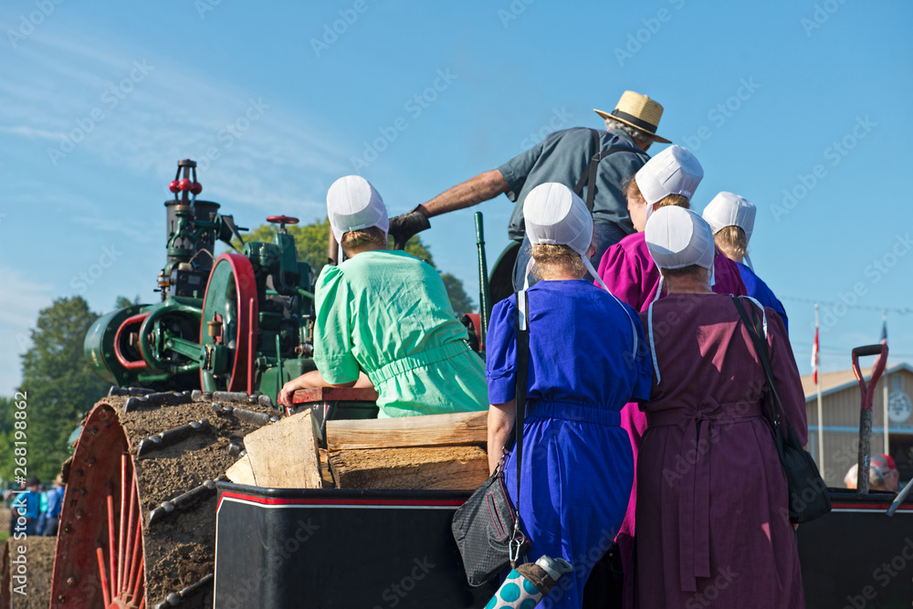 Amish Ladies with Dad on Steam Engine Amish Ladies with Dad on Steam Engine