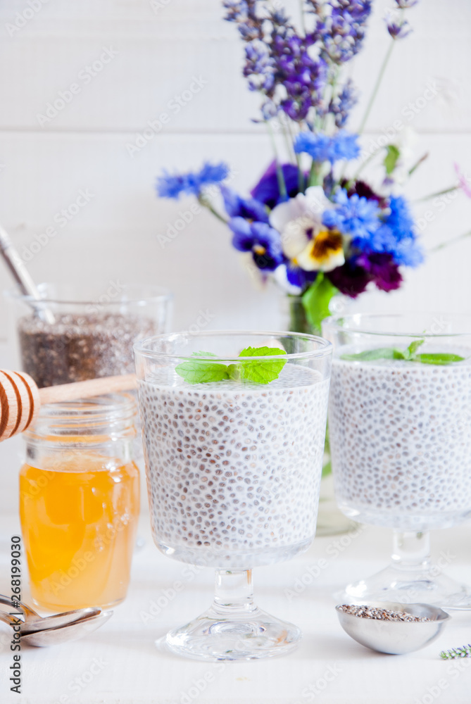 Chia seeds yogurt pudding with honey in glasses for breakfast Chia seeds yogurt pudding with honey in glasses for breakfast