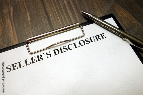 Fotografie Clipboard with sellers disclosure mockup and pen on desk