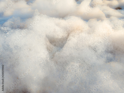 Closeup macro abstract image of soap foam in bright sunny days. Closeup photo of clouds
