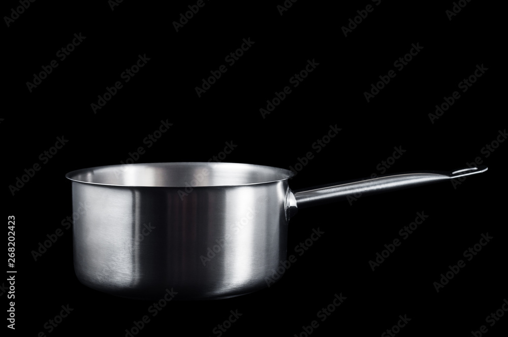 Stainless steel saucepan with handle on black background, isolate Stainless steel saucepan with handle on black background, isolate