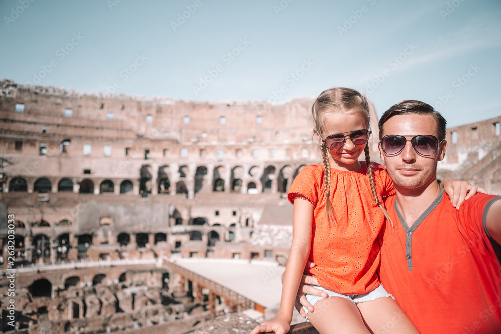 Happy family in Rome over Coliseum background