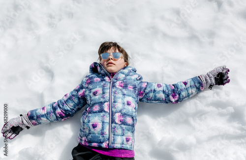 Portrait of a little girl in the snow