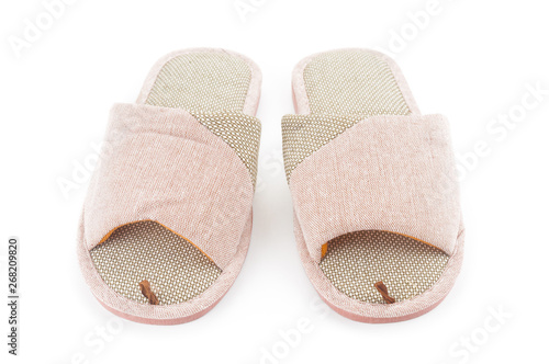 Pair of home slippers close up isolated on white background