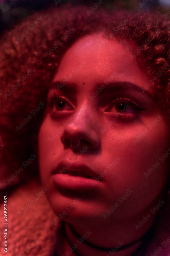 dramatic photo of young woman in red light dramatic photo of young woman in red light