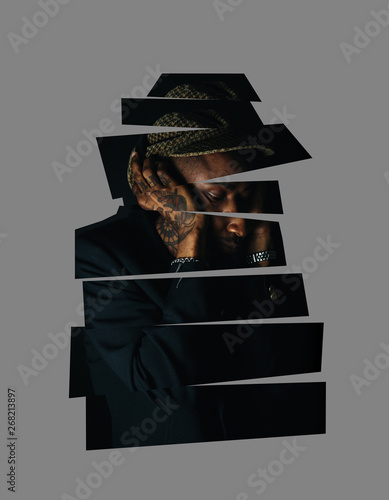 Digitally manipulated portrait of a cool black man wearing black clothing and cap.
