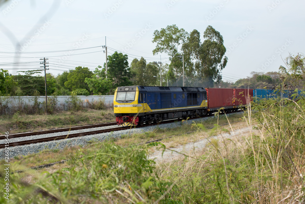 High Speed Electric train. Cargo train platform with freight train container at depot in port use for export logistics background. Passenger diesel train traveling speed railway wagons journey light High Speed Electric train. Cargo train platform with freight train container at depot in port use for export logistics background. Passenger diesel train traveling speed railway wagons journey light