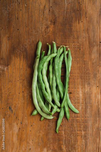 Beans on an old wooden background.