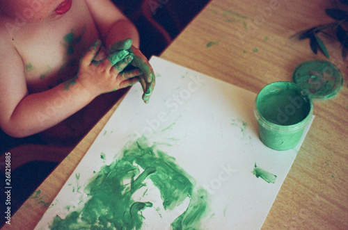 A beautiful kid painting photo