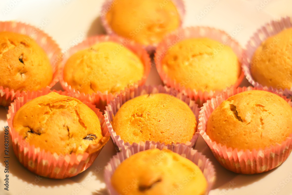 Homemade sweet muffin baking in a molds in oven Homemade sweet muffin baking in a molds in oven