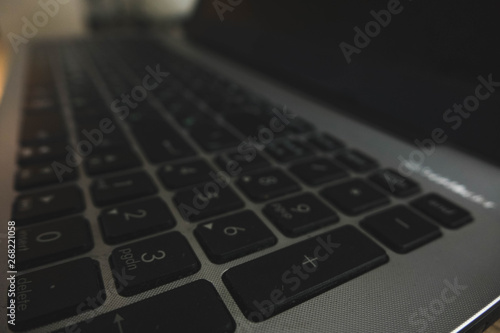 laptop keyboard close-up in two languages: Russian and English