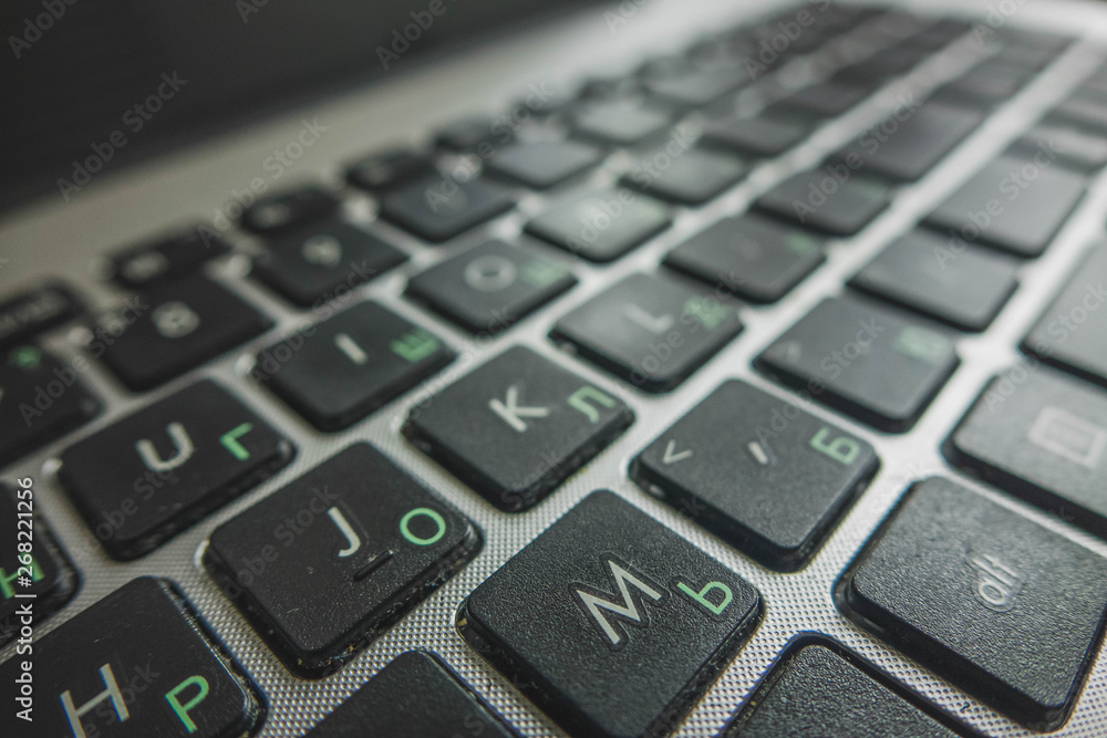 laptop keyboard close-up in two languages: Russian and English laptop keyboard close-up in two languages: Russian and English