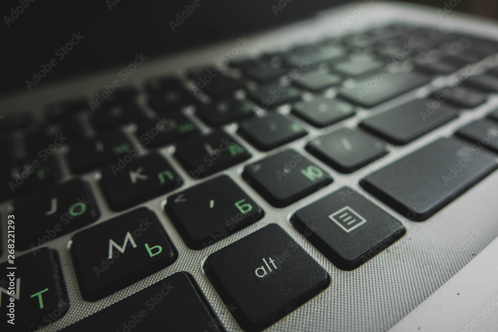 laptop keyboard close-up in two languages: Russian and English laptop keyboard close-up in two languages: Russian and English