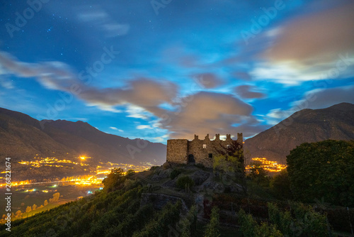 Starry sky over ruins of Castel Grumello, Lombardy, Italy photo