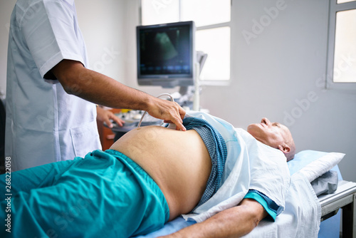 Senior man having an ultrasound exam photo