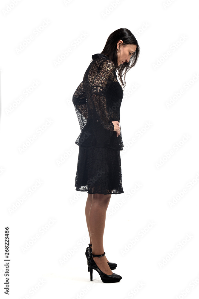 full portrait of a middle age woman with dress and heeled shoes isolated on white full portrait of a middle age woman with dress and heeled shoes isolated on white