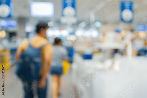 Blurred bix box store supercenter with customers shopping for home goods. © Travis