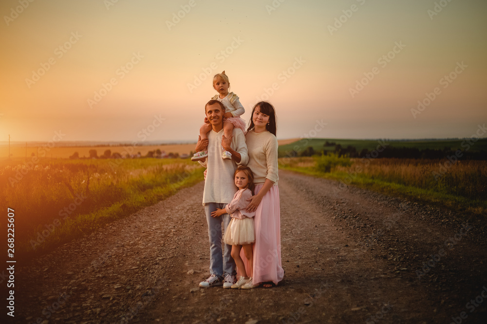 Mom, dad and daughters outdoor