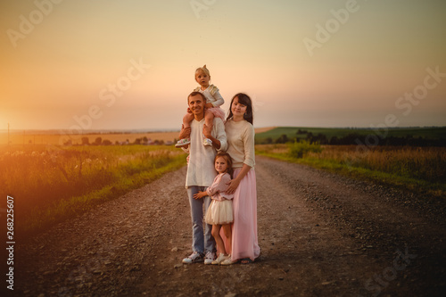 Mom, dad and daughters outdoor