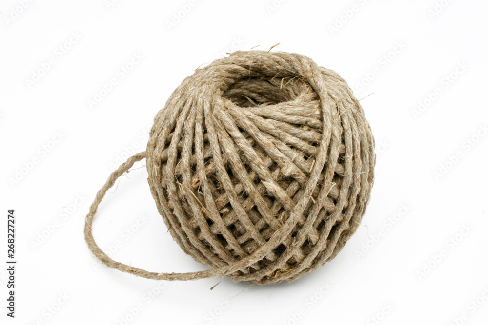 Ball of string linen twine at the white background Ball of string linen twine at the white background