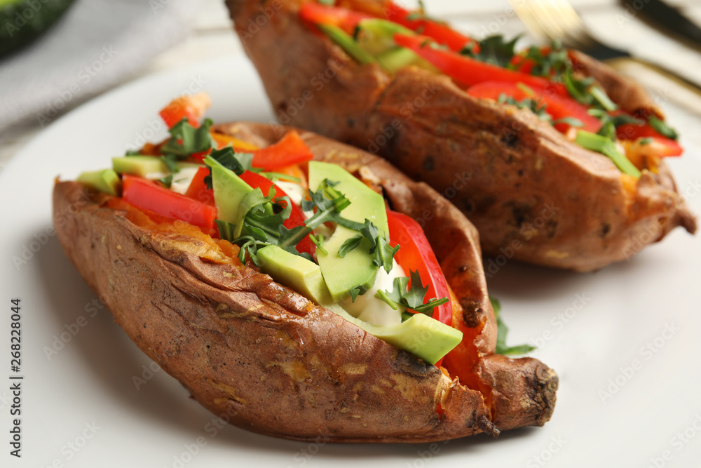 Stuffed sweet potatoes served on plate, closeup Stuffed sweet potatoes served on plate, closeup
