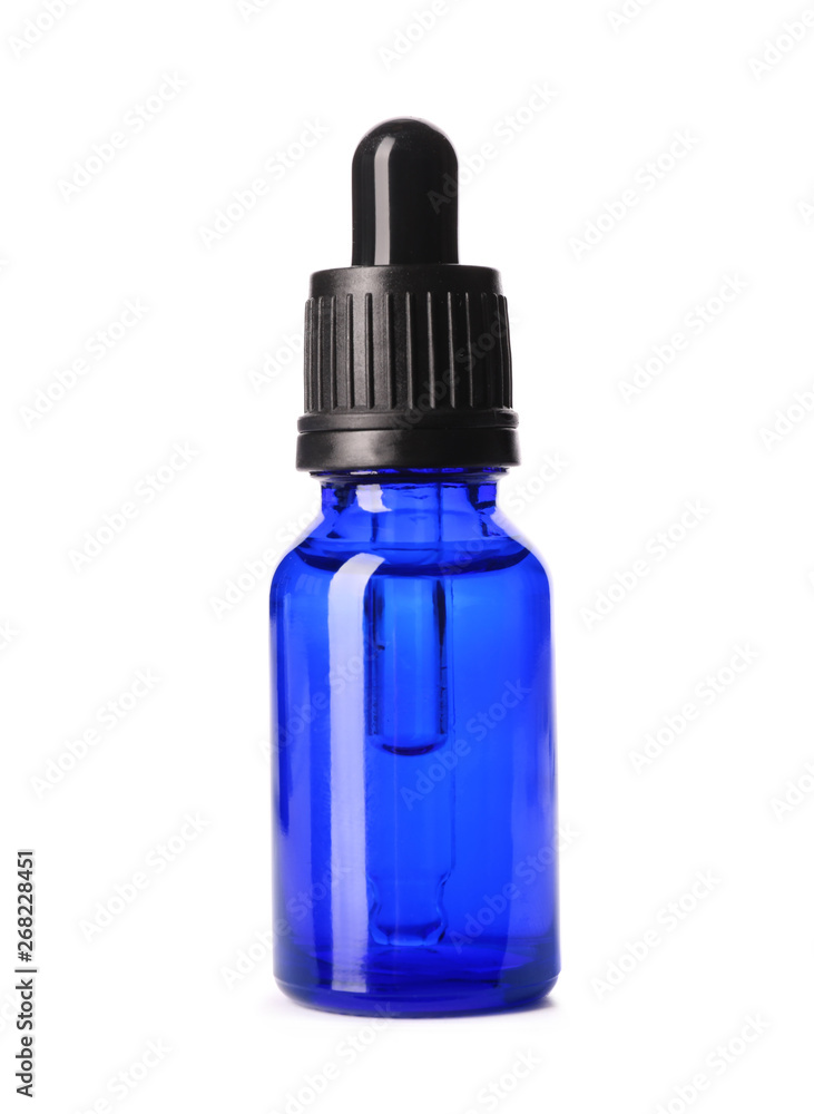 Cosmetic bottle of essential oil on white background
