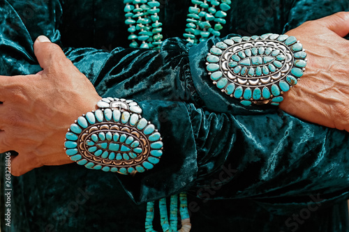 Navajo man with turquoise bracelets photo