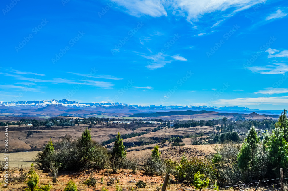 Fototapeta premium Underberg landscape with Snow capped Drakensberg Maloti mountains
