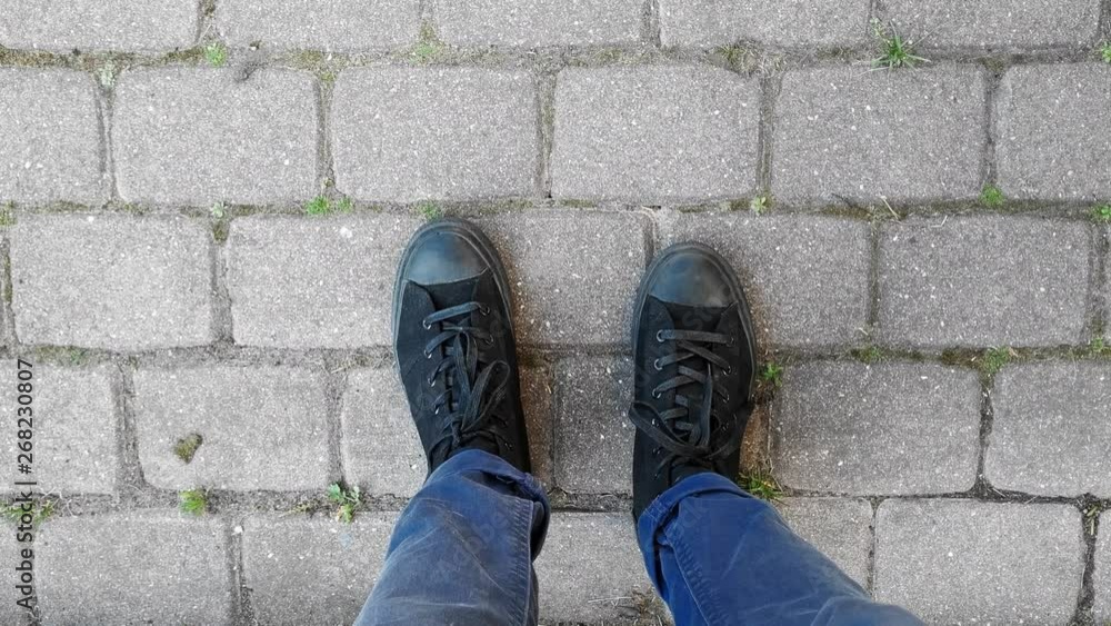 Action cam point of view shot of young man looking at his feet and jumping from stairs. Action cam point of view shot of young man looking at his feet and jumping from stairs.