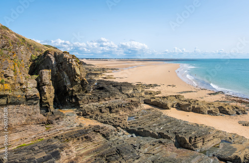 Rocky coast and beach on the Cape Carteret. Normandy, France