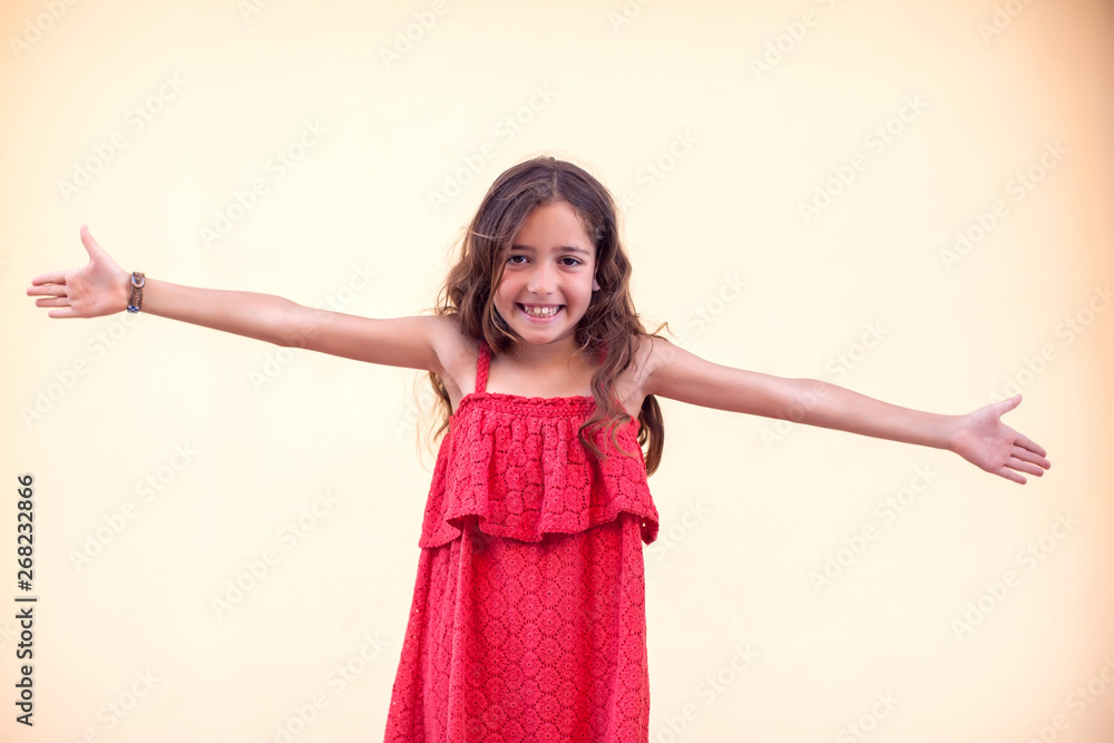 Little girl shows open hands at camera and smile. Children and emotions concept Little girl shows open hands at camera and smile. Children and emotions concept