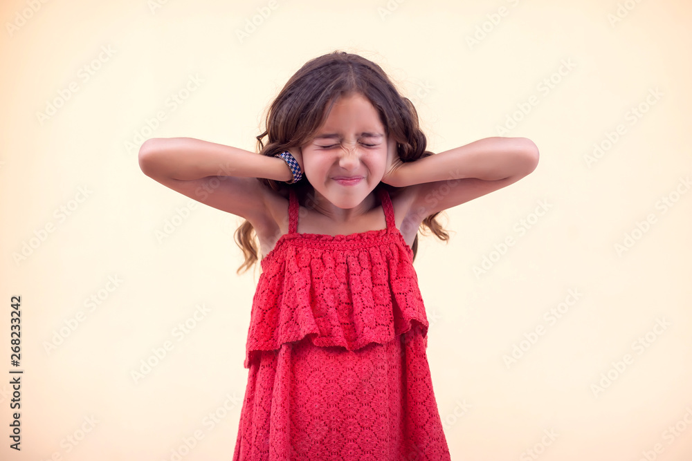 Little girl closed her ears. Children and emotions concept Little girl closed her ears. Children and emotions concept