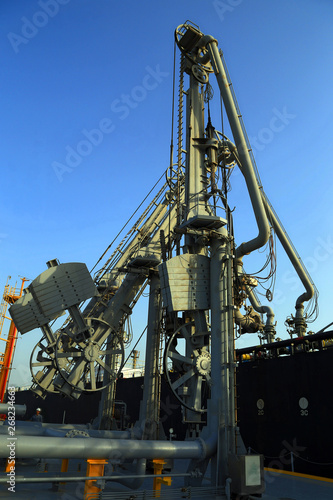 Cranes unloading a cargo vessel © DanishIqb